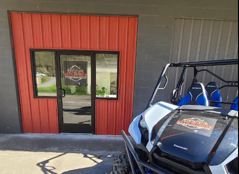 Off-road side-by-side parked outside Haysi Off-Road Adventures