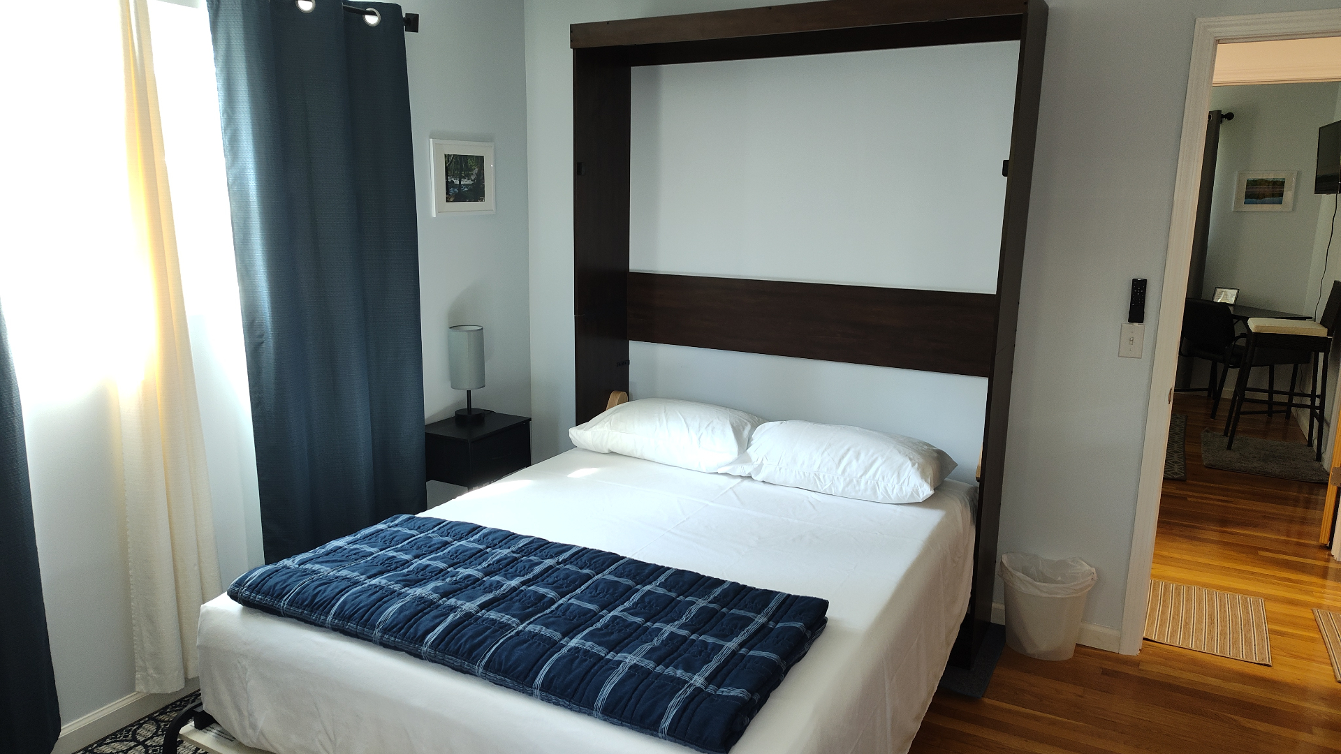 Suite bedroom with murphy bed and blue accents